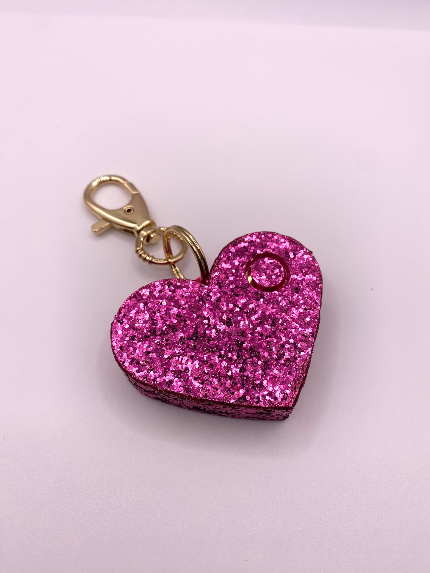 pink glitter heart shaped personal alarm with gold lobster clamp 